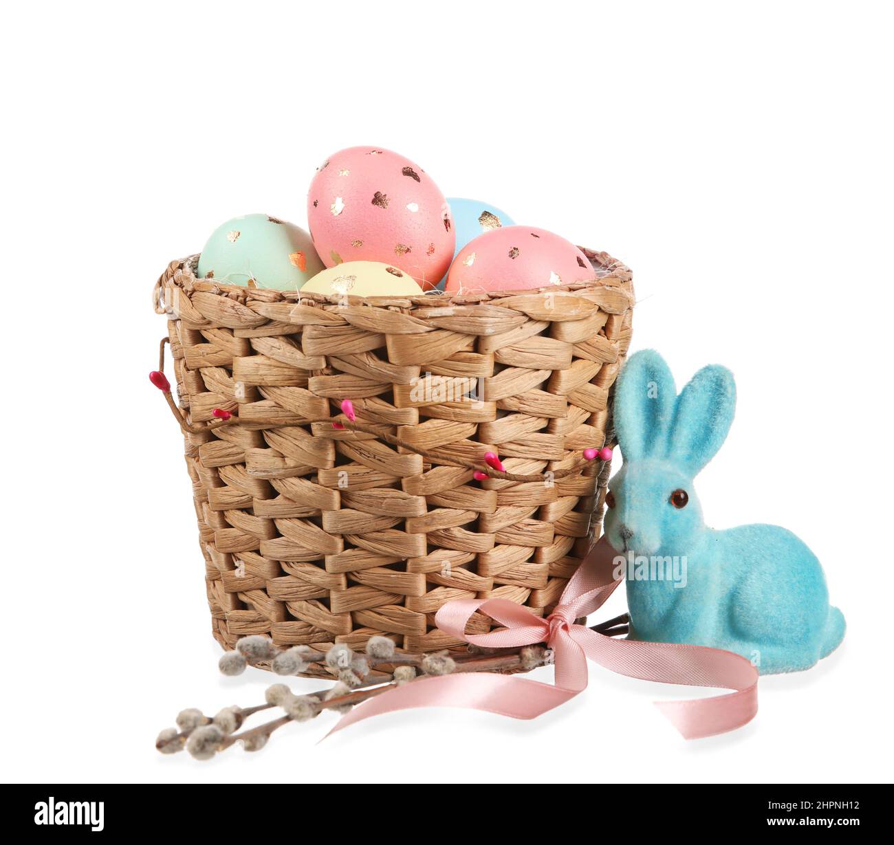 Basket with painted Easter eggs, bunny and willow branches on white ...
