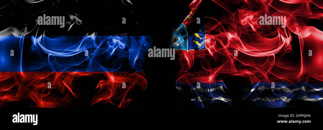 Donetsk People's Republic vs Russia, Russian, Magadan Oblast flag. Smoke flags placed side by side isolated on black background. Stock Photo