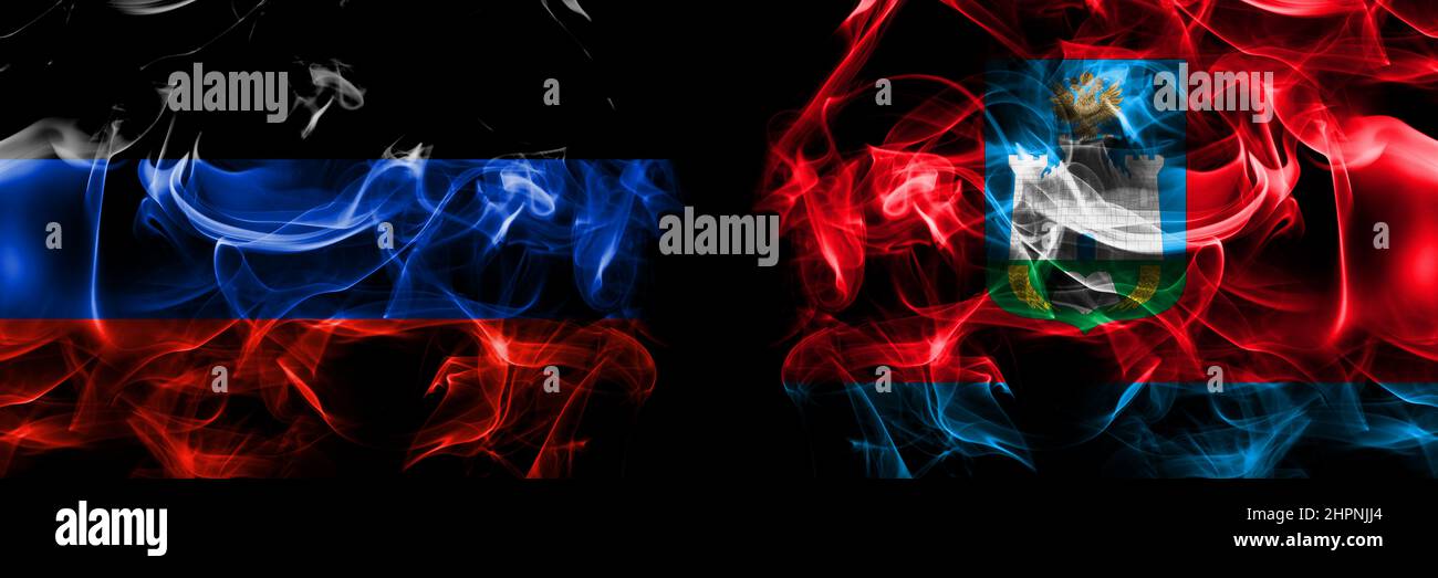 Donetsk People's Republic vs Russia, Russian, Oryol Oblast flag. Smoke flags placed side by side isolated on black background. Stock Photo