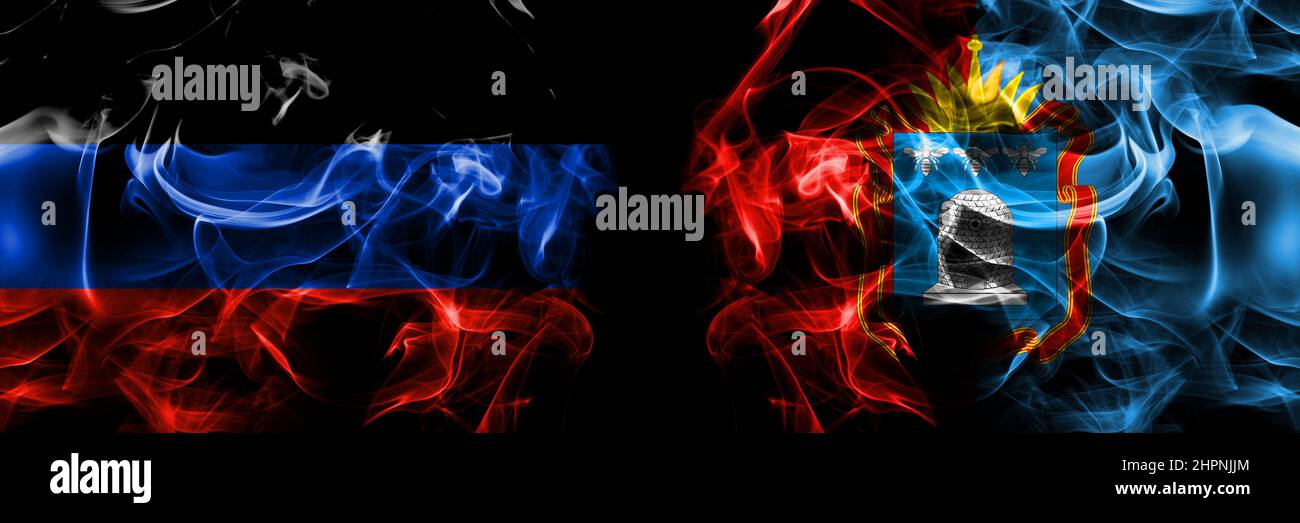 Donetsk People's Republic vs Russia, Russian, Tambov Oblast flag. Smoke flags placed side by side isolated on black background. Stock Photo