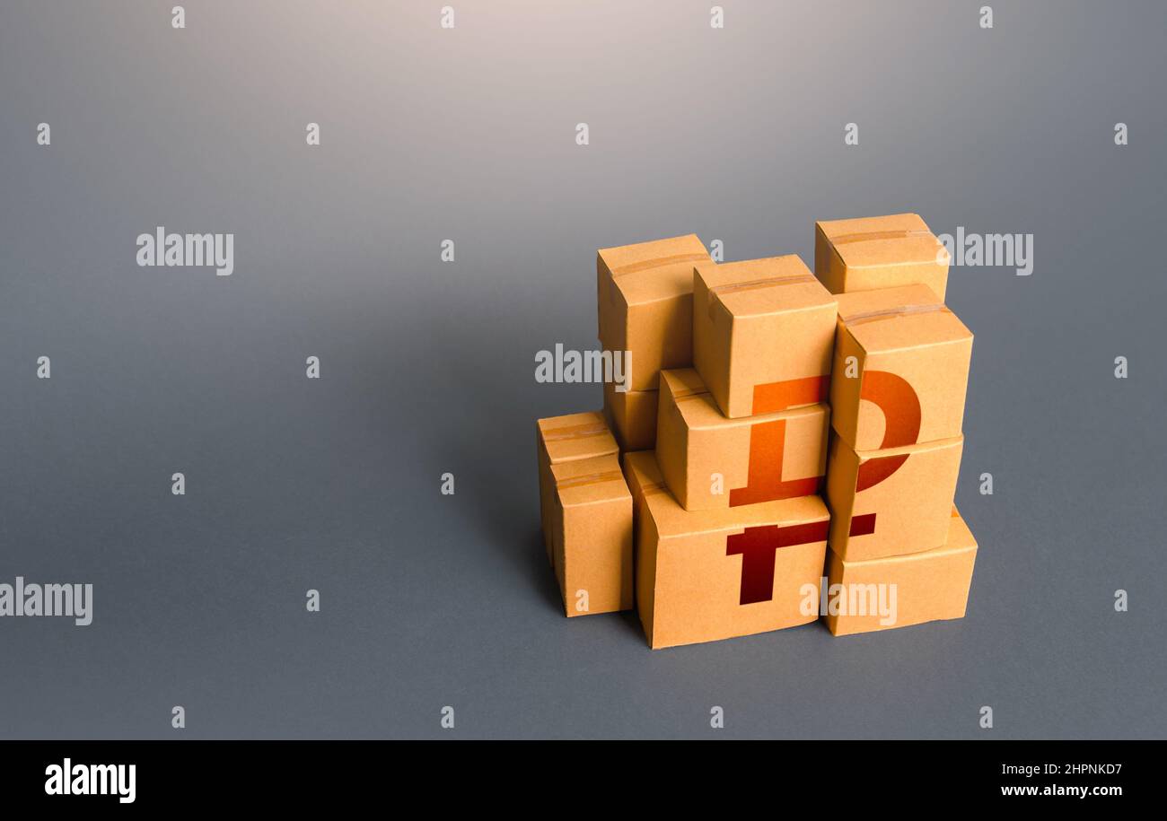 Boxes with russian ruble symbol. Distribution of goods. Transportation logistics. Retail of products. Consumption economics, imports and exports. Gros Stock Photo