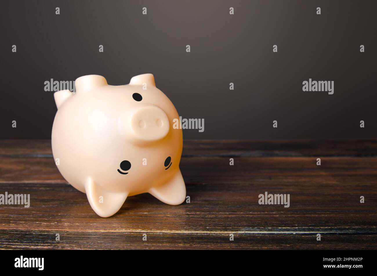 Surprised upside down piggy bank. Stunning interest rates on deposits. Savings. Opportunities and prospects. High income and earnings. Discounts and s Stock Photo