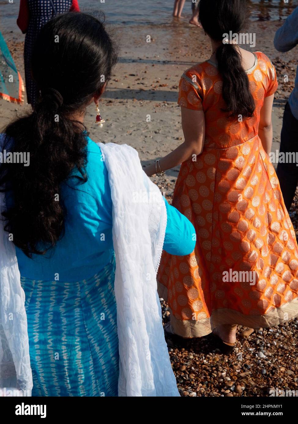 AJAXNETPHOTO. WORTHING, ENGLAND. 28TH AUGUST, 2017. - Celebrating Ganesh Festival in the U.K. -  Members of the local Hindu community in colourful traditional dress attending the annual festival held on the beach. Also known as Ganesh Chaturthi, the important festival celebrates the elephant-headed son of Lord shiva and Goddess Parvati, a symbol of wisdom, prosperity and good fortune. The model is made of plaster of paris and dissolves in sea-water.  PHOTO:JONATHAN EASTLAND/AJAXREF:GXR172708 76825 Stock Photo