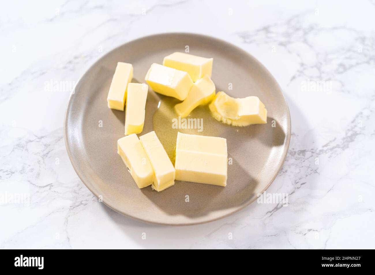 Softened sticks of unsalted butter on in the microwave Stock Photo Alamy