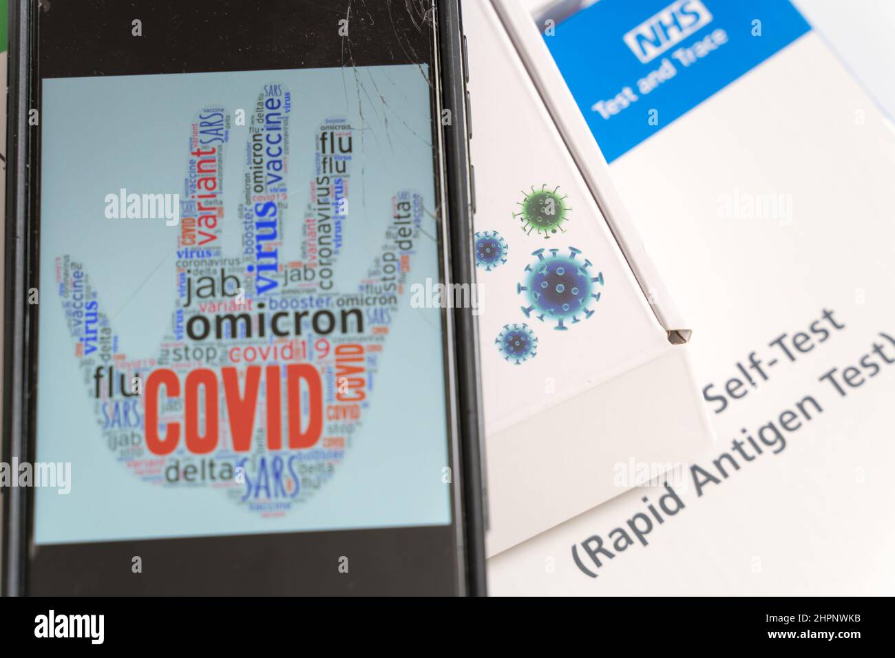 Mobile device showing a COVID sign while England are finding a way out of pandemic , learn to live with COVID UK Stock Photo
