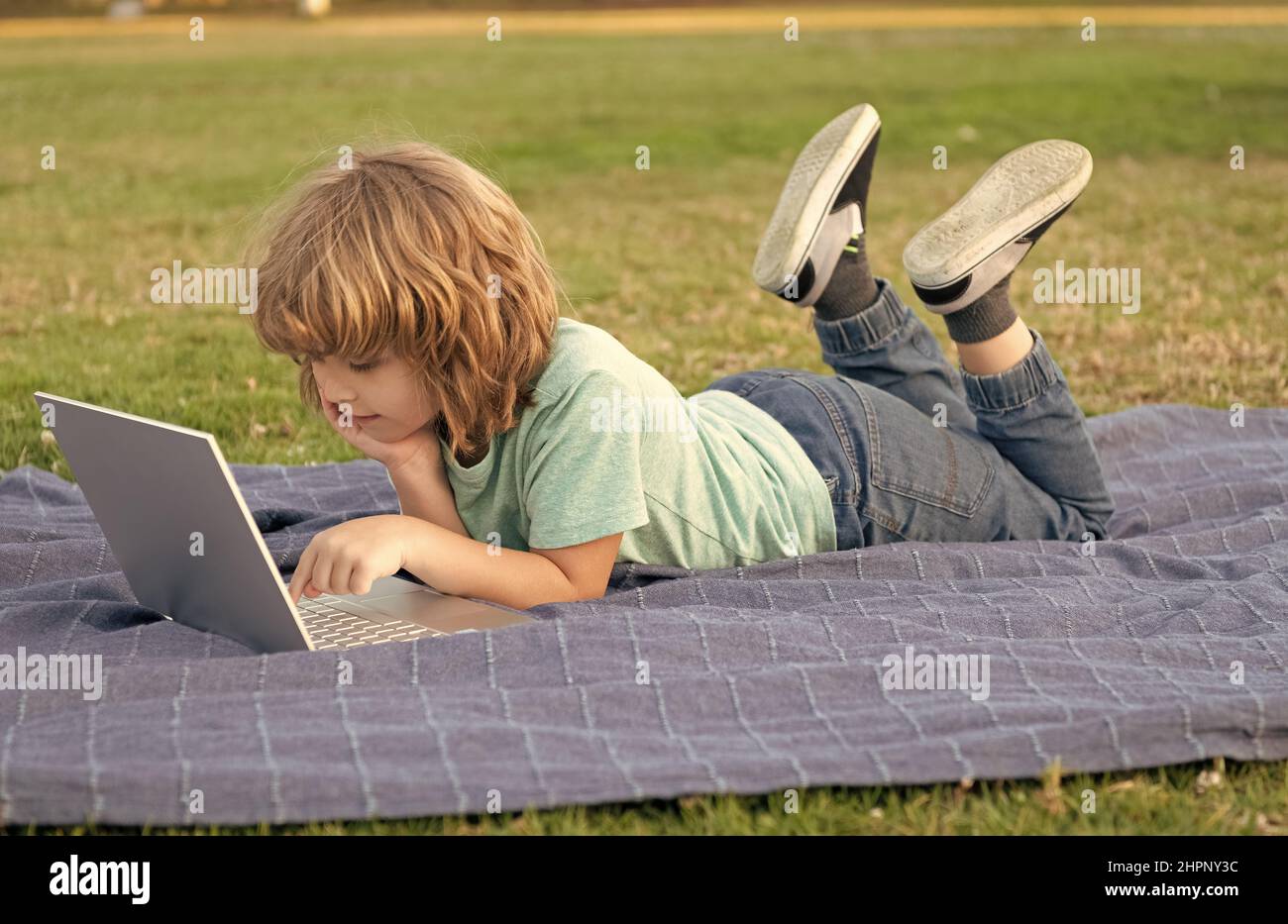Kid on laptop hi-res stock photography and images - Alamy