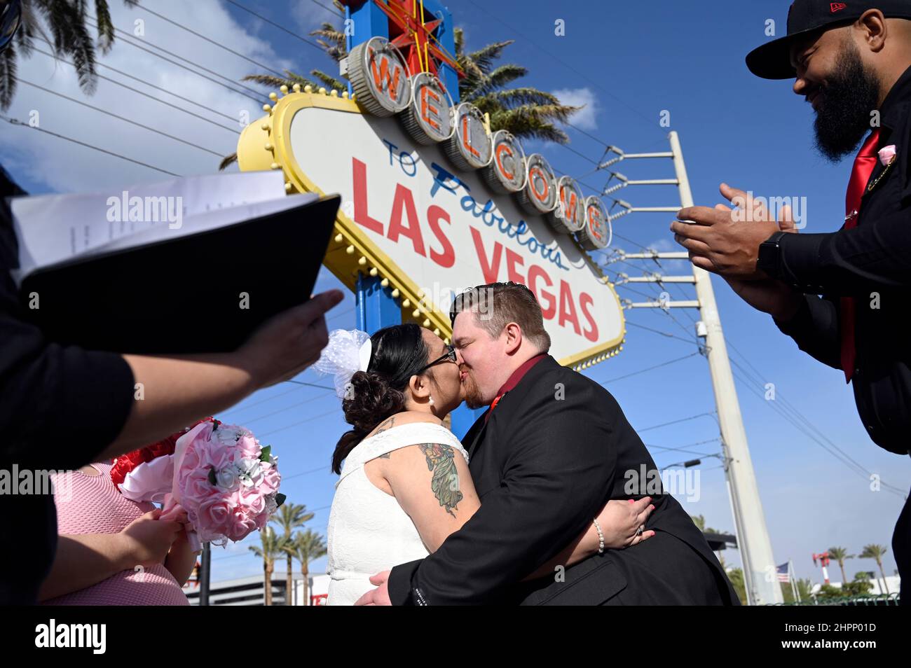 Las Vegas, Nevada, USA. 22nd Feb, 2022. Jacquelyn and Robert Carrillo, of New Mexico, kiss as they complete they wedding vows at the Welcome to Fabulous Las Vegas sign on Feb. 2, 2022. Las Vegas, dubbed the wedding capital of the world, recently issued their five millionth wedding license. (Credit Image: © David Becker/ZUMA Press Wire) Stock Photo