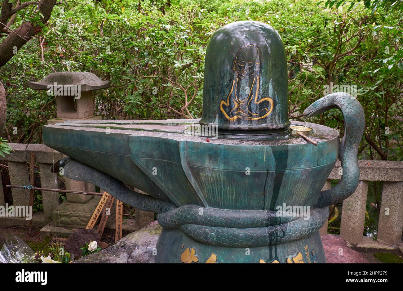 Nagoya, Japan – October 20, 2019: The bronze Shiva Linga in Toganji temple. The symbol of lingam-yoni, the union of the feminine and the masculine in Stock Photo