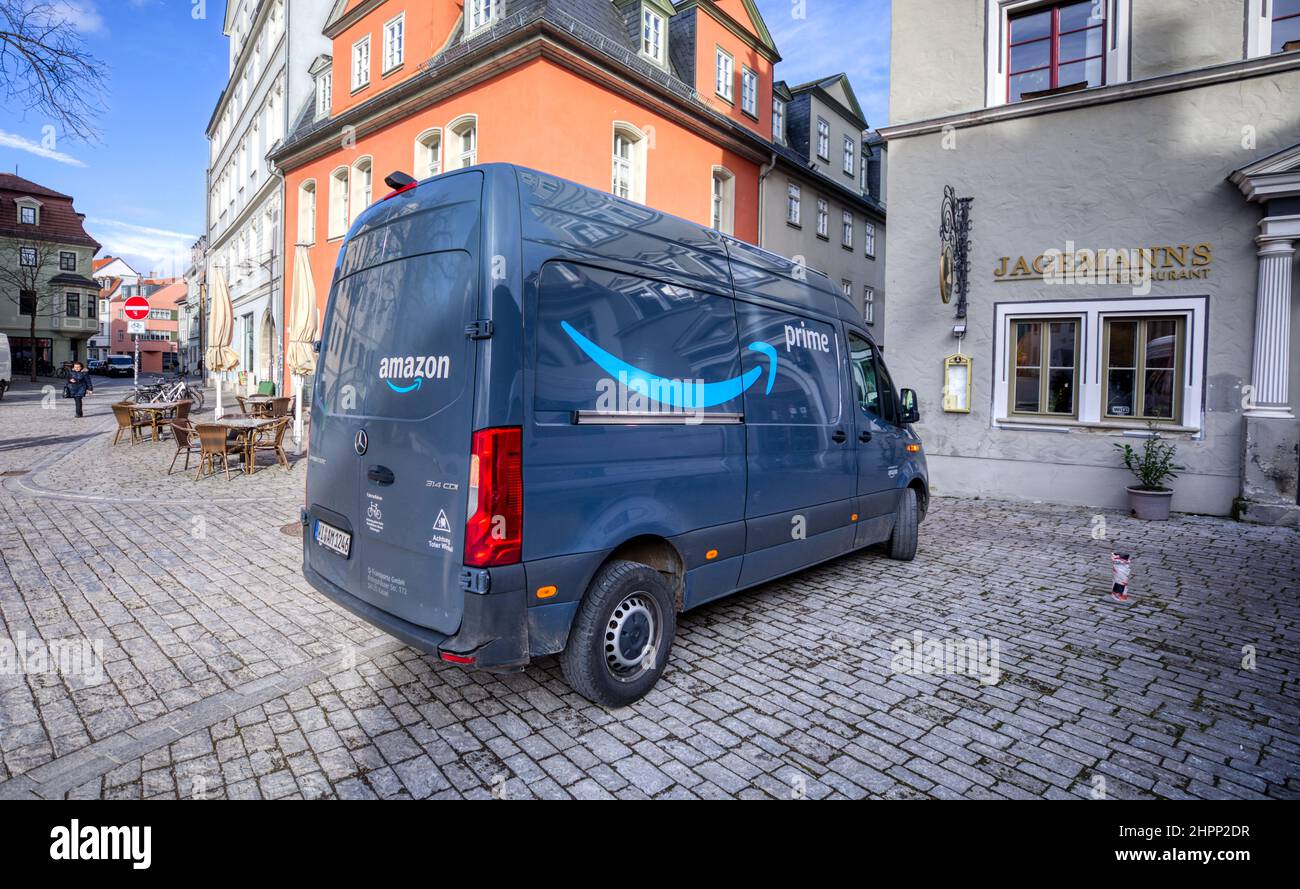 Weimar, Germany - February 21, 2022: Mercedes Sprinter van from Amazon Prime stands in a pedestrian area to load packages Stock Photo