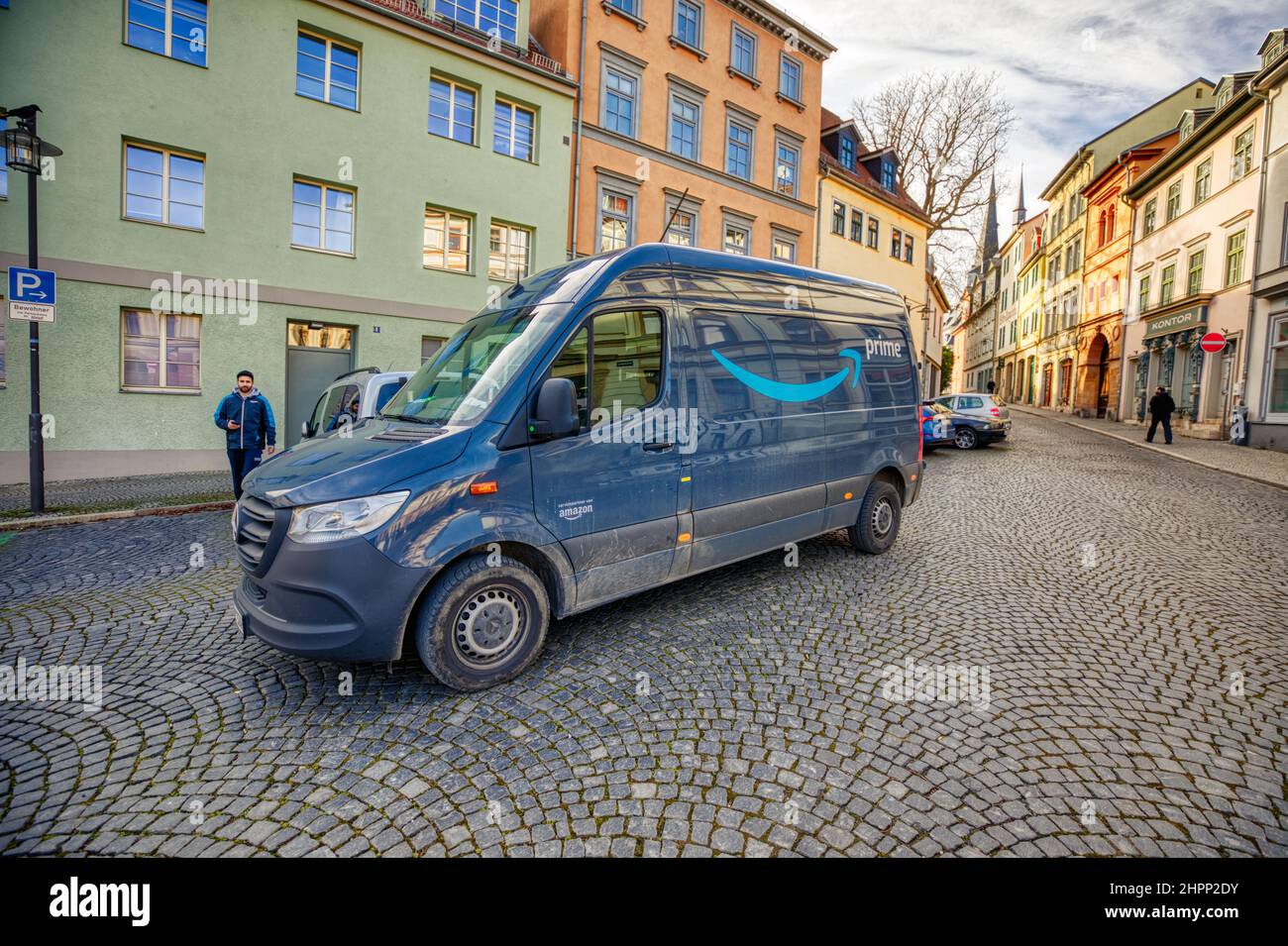 Weimar, Germany - February 21, 2022: Mercedes Sprinter van from Amazon Prime stands in a pedestrian area to load packages Stock Photo