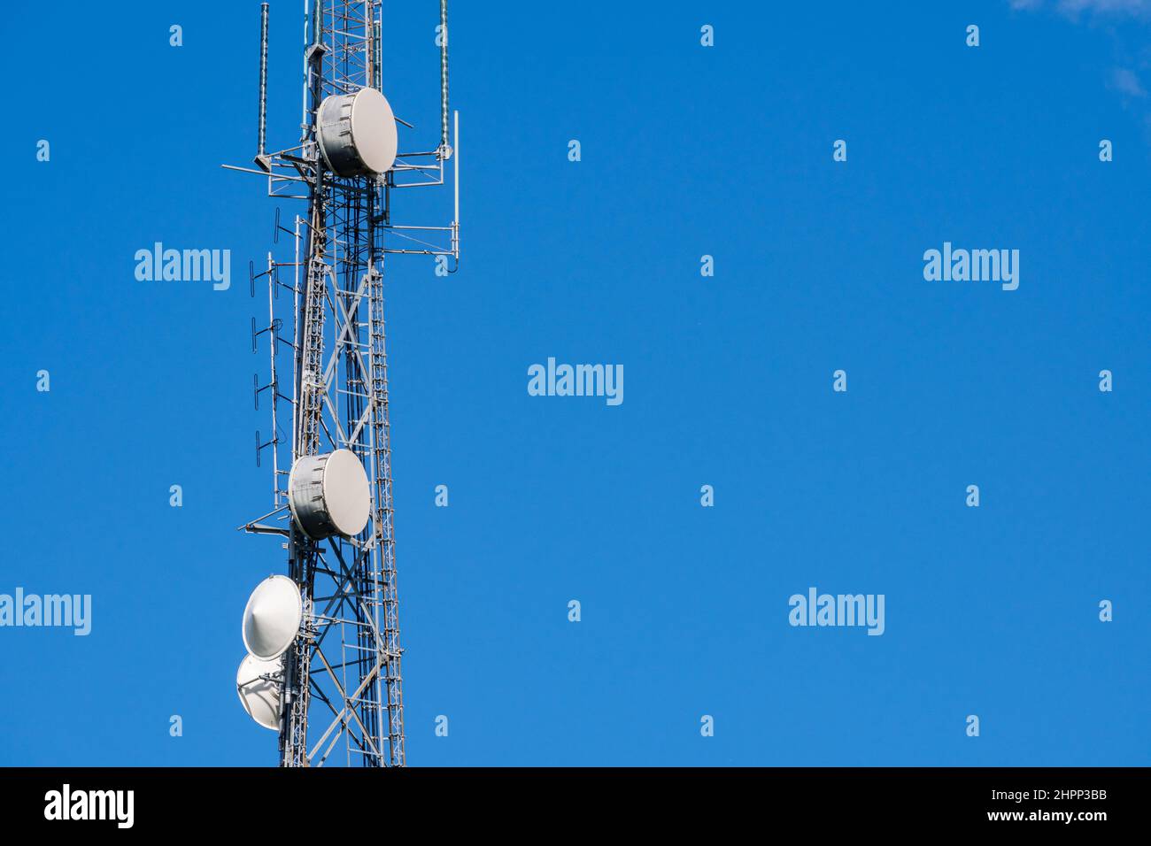 Closeup of lattice cell tower with microwave antennas, with copyspace - Davie, Florida, USA Stock Photo