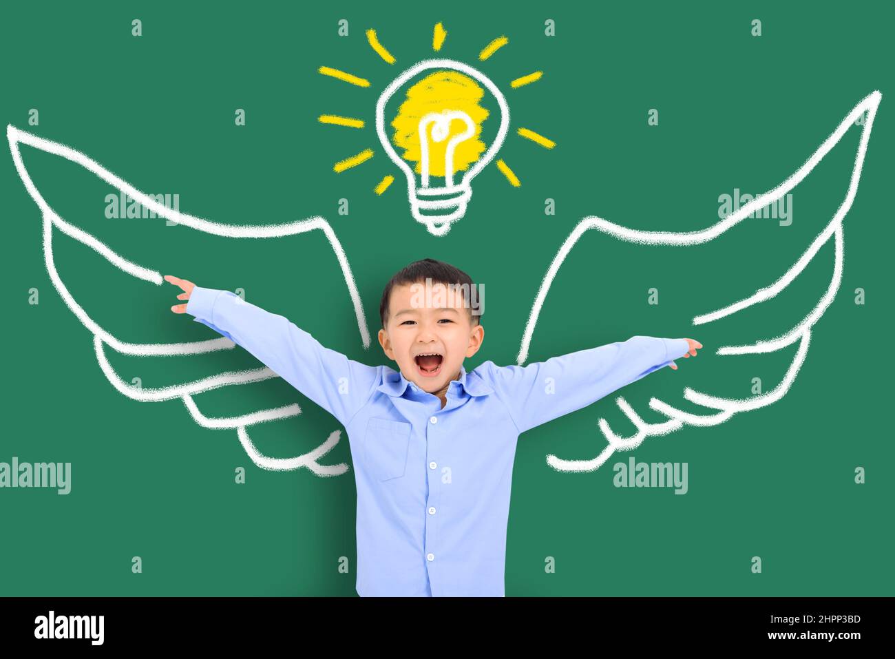 Smart kid with wing in class. Imagination, idea and success concept Stock Photo