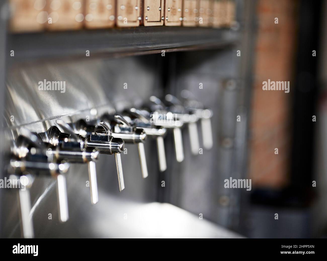 Close up of a beer tapper faucet with handle and shallow depth of field Stock Photo