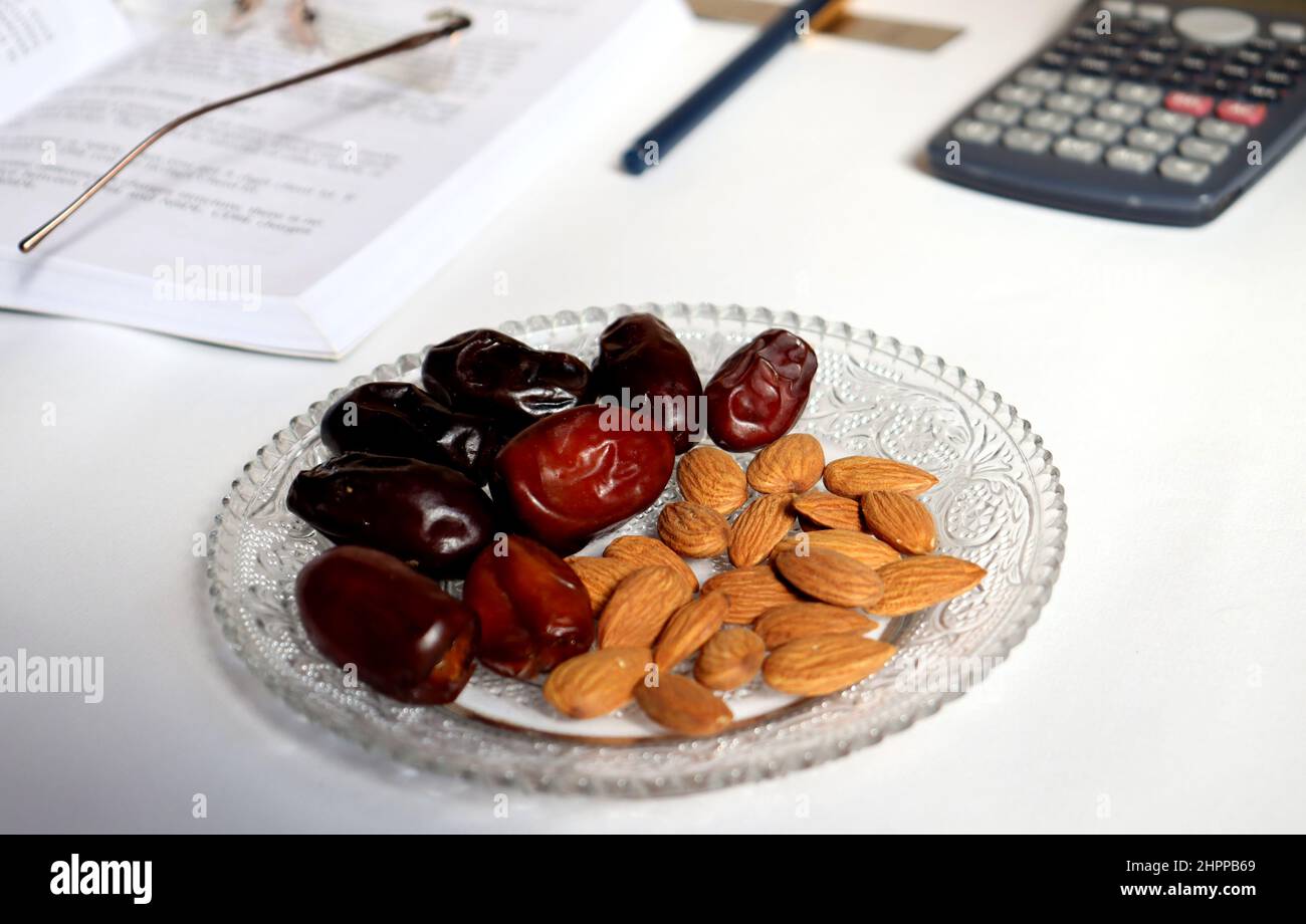 Almond and date healthy dri food,reduce cholesterol and blood sugar,energy boosting dry food,rich carbohydrate and lower fat Stock Photo