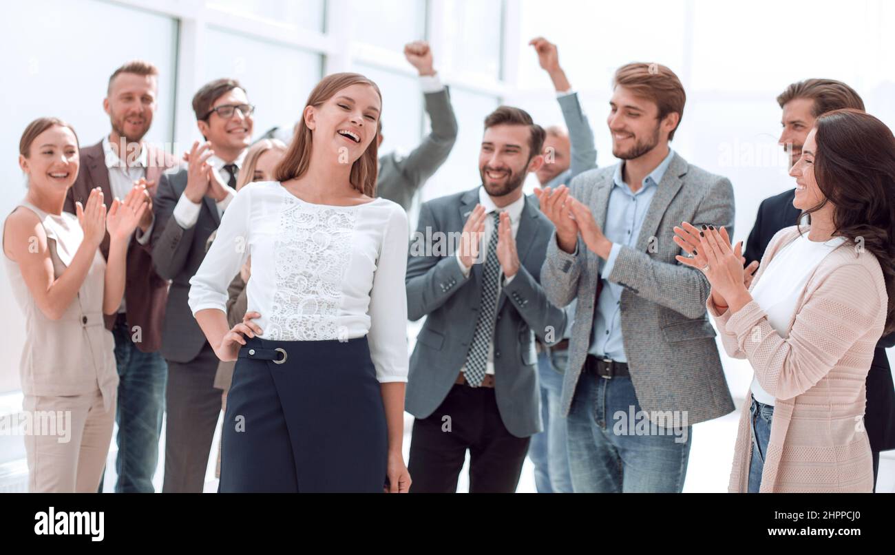 creative business team congratulating their young colleague . success ...