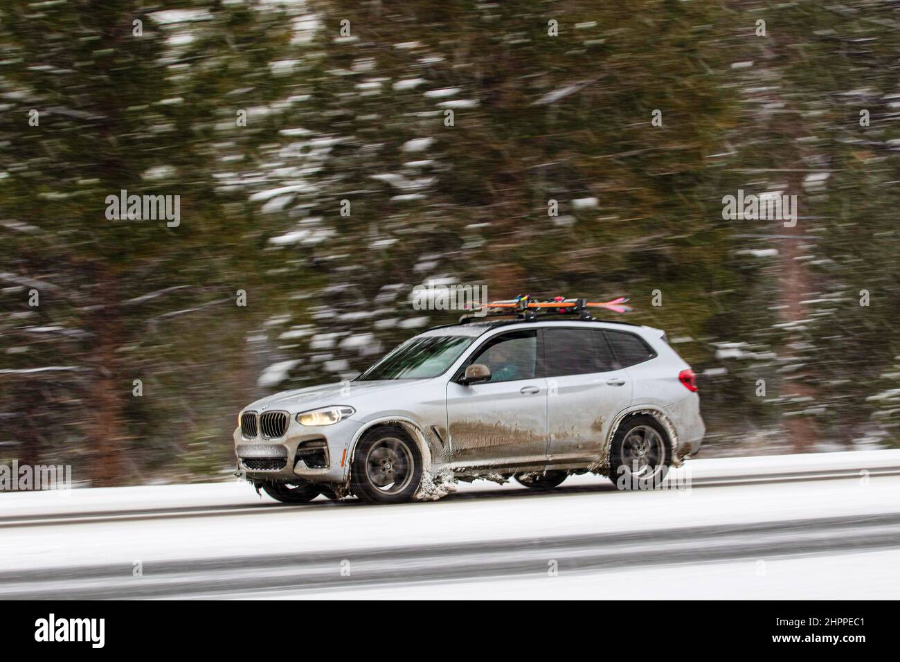 Reno, United States. 22nd Feb, 2022. A snow covers a car with skis on