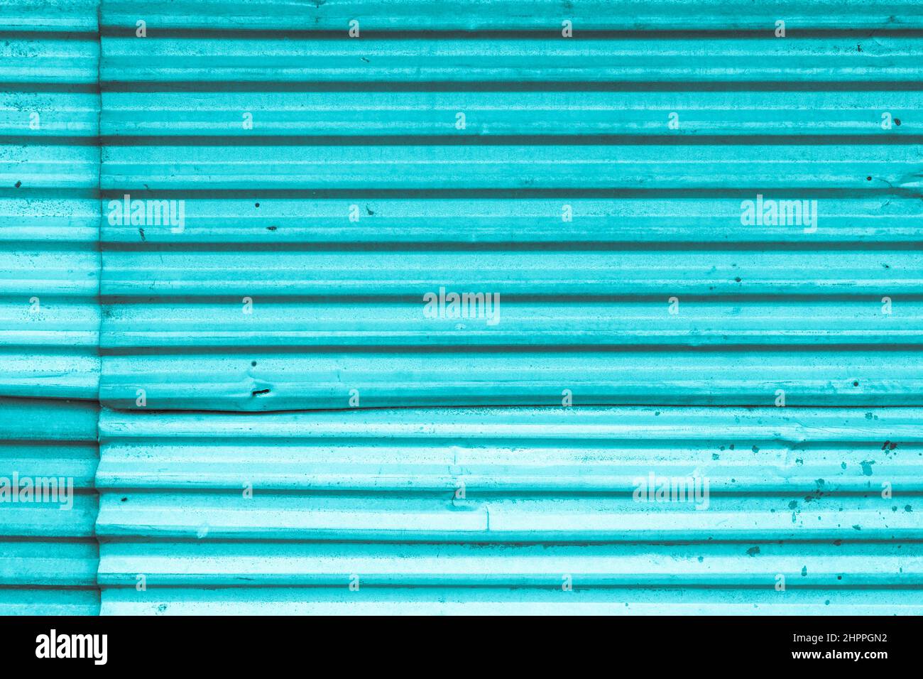 Blue colored metal store front iron curtain texture background Stock Photo