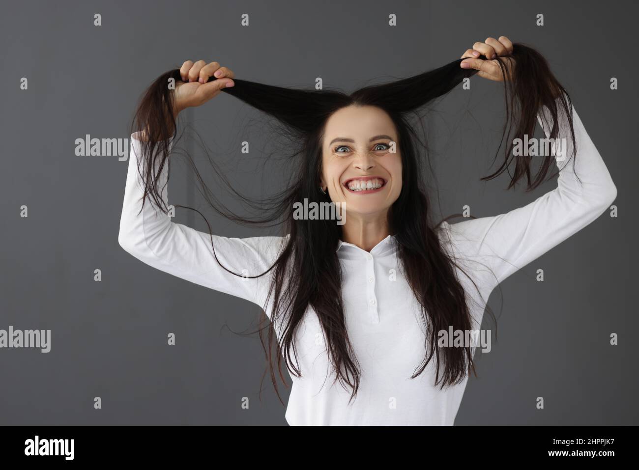 Portrait of young angry hysterical woman closeup Stock Photo