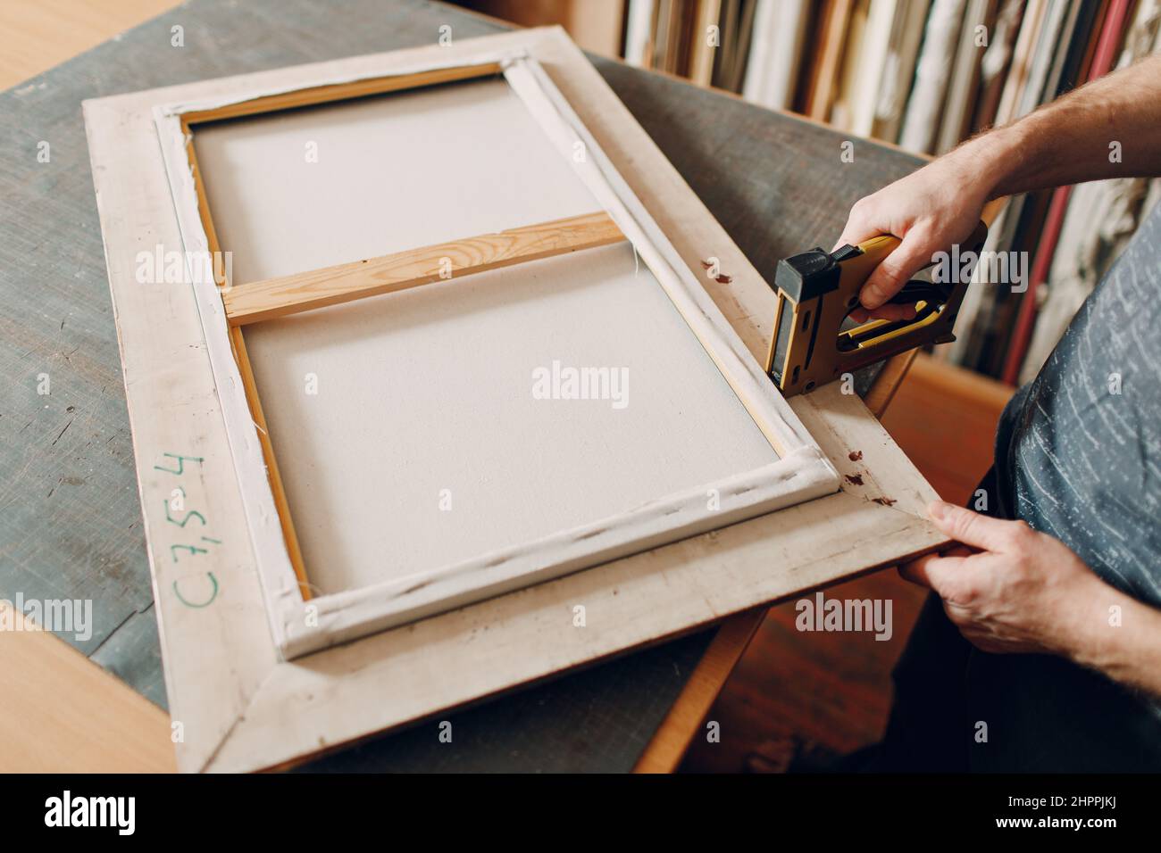 Framing assembling. Stapler ruler and frames baguette handmade