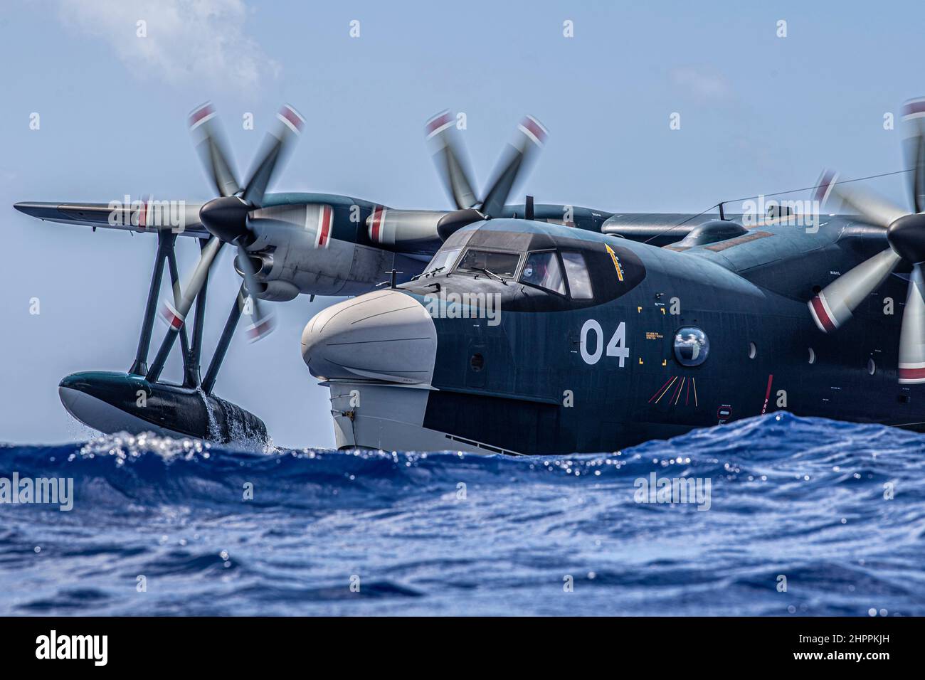 A Japanese ShinMaywa US-2 floats in the ocean during exercise Cope North 22 at the Island of Tinian near Andersen Air Force Base, Guam, Feb. 14, 2022. Japanese and U.S. Air Force members trained together in participation of Cope North 2022, multilateral U.S. Pacific Air Forces-sponsored field training exercise conducted annually at Andersen AFB, Guam focused on combat air forces’ large-force employment and humanitarian assistance and disaster relief training to enhance interoperability among U.S., Australian, and Japanese forces. (U.S. Air Force photo by Senior Airman Joseph P. LeVeille) Stock Photo