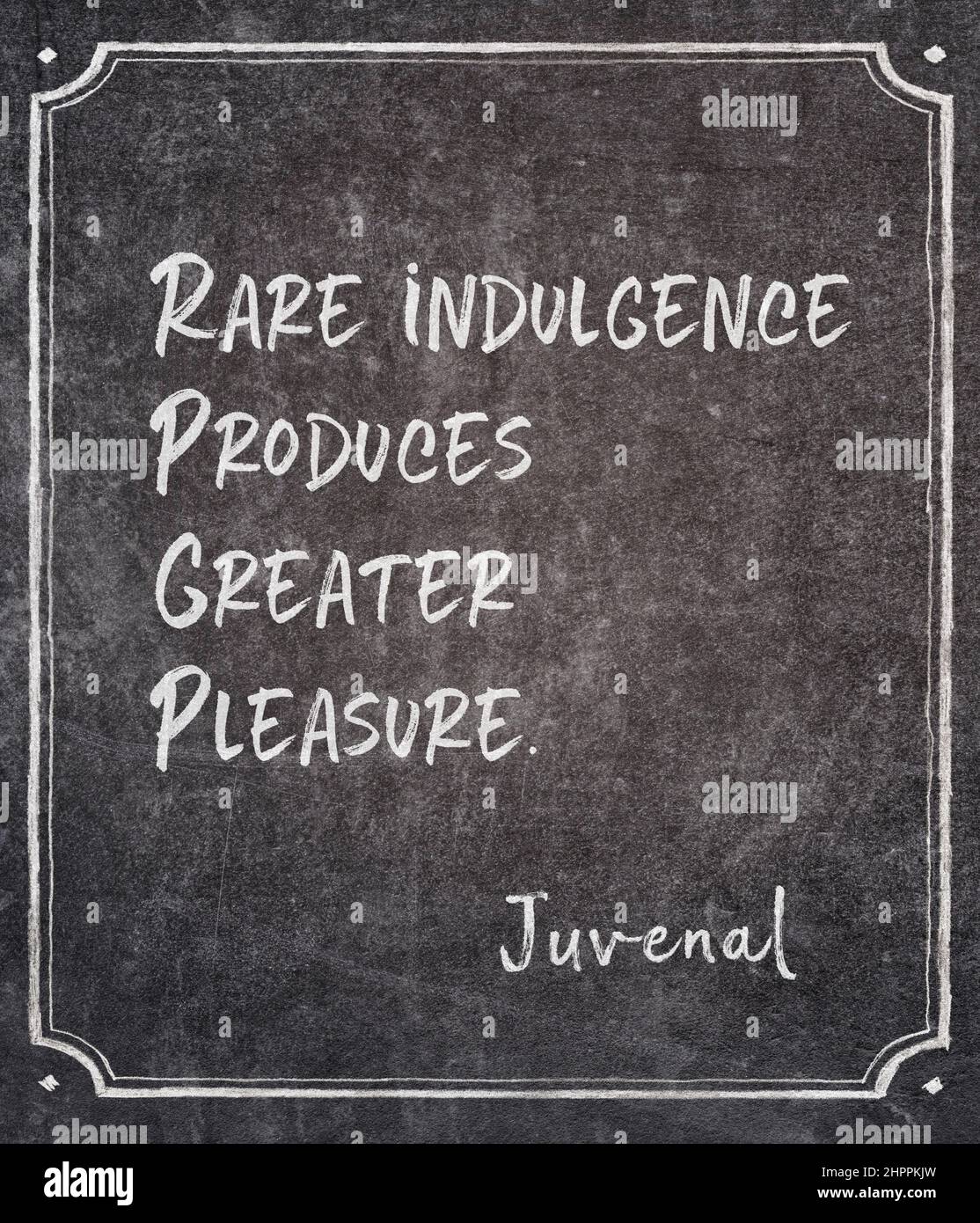 Rare indulgence produces greater pleasure - ancient Roman poet Juvenal quote written on framed chalkboard Stock Photo