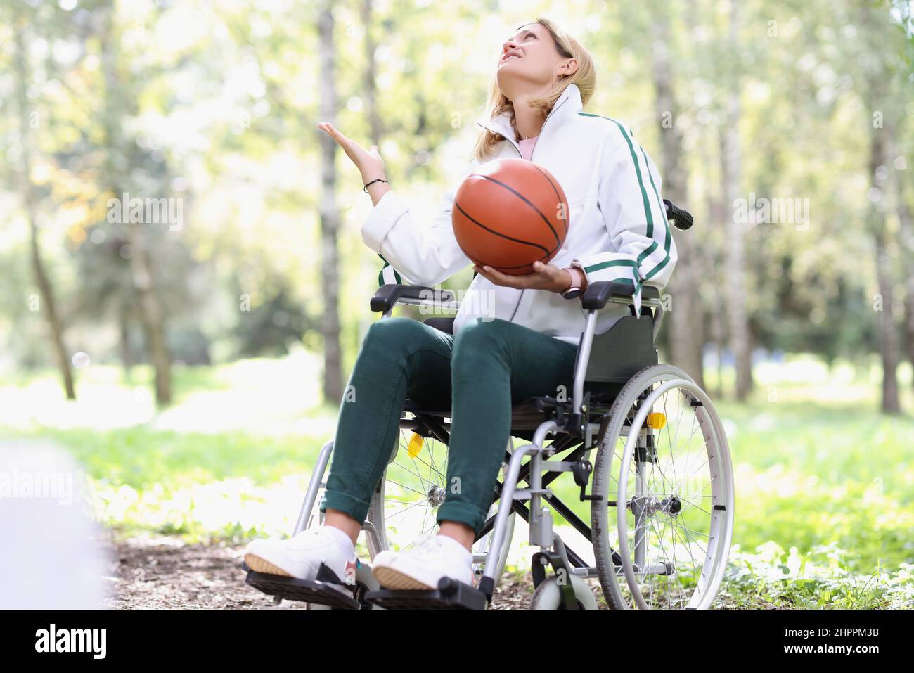 Young woman holding basketball in hi-res stock photography and images ...