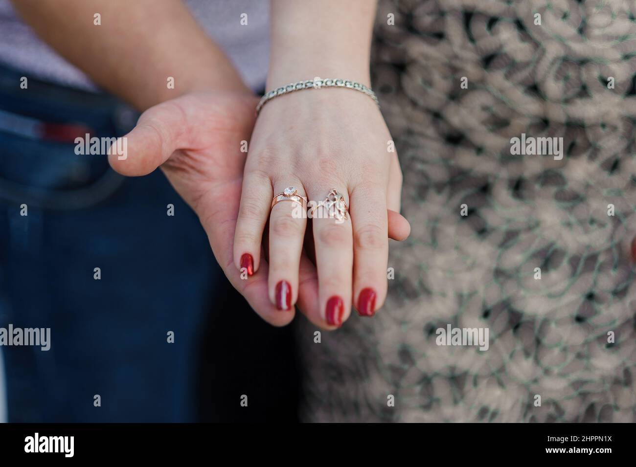 An offer of marriage. Golden ring on a woman's hand Stock Photo