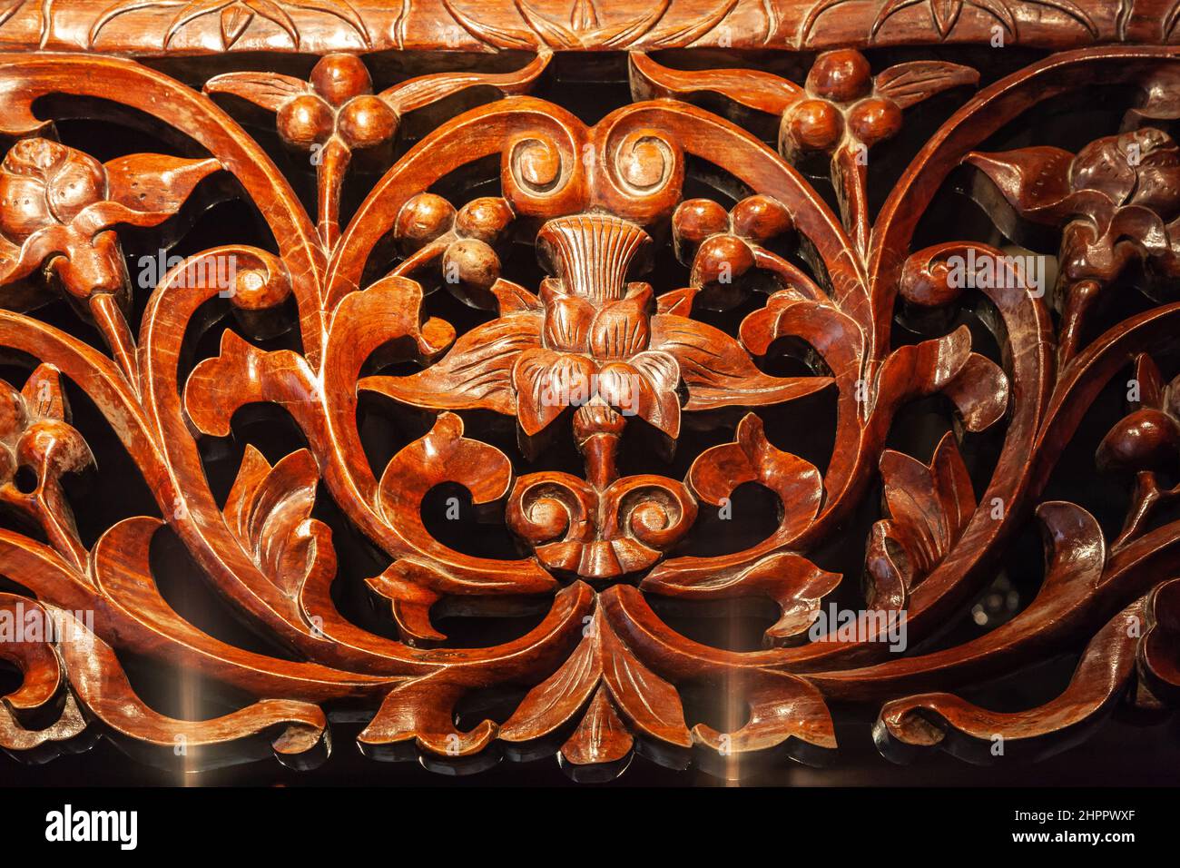 Detail of a wood carving of a traditional bed. Evening light. Wenzhou, China Stock Photo