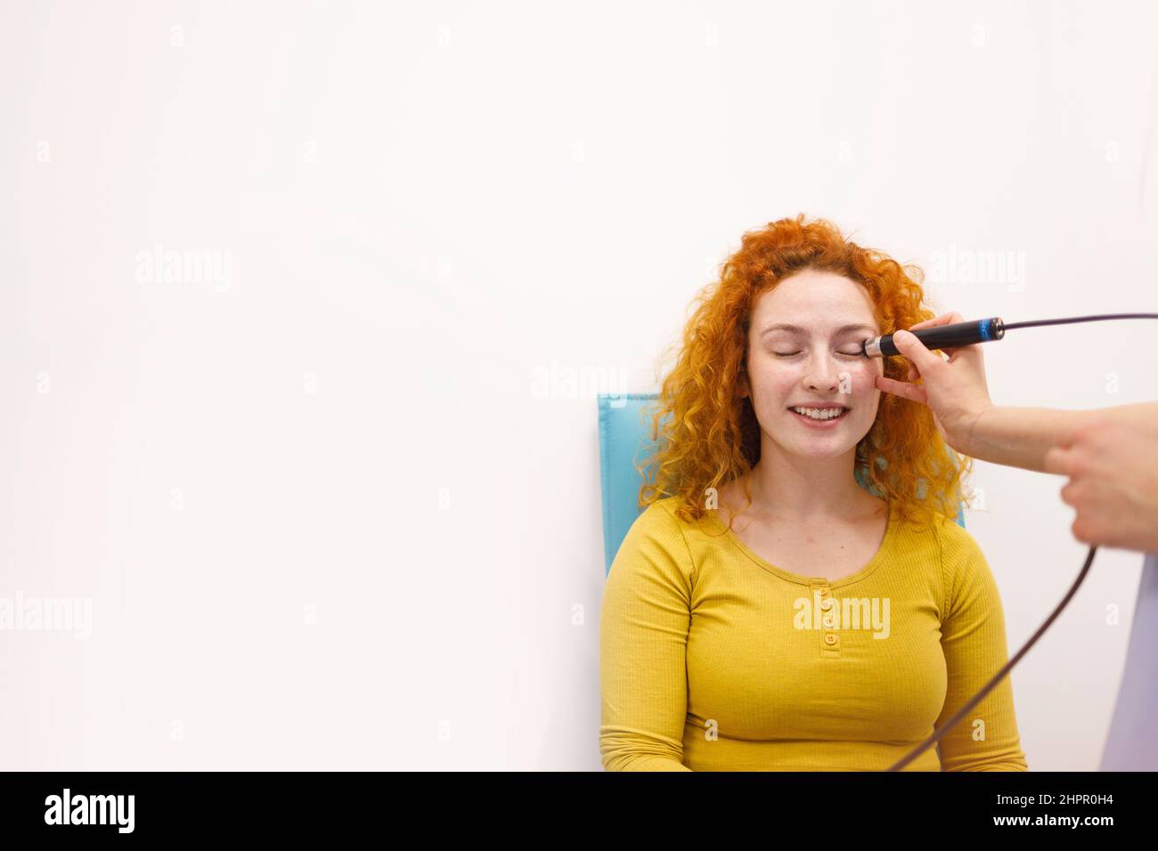 Female patient during her eye pressure assessment at her eye clinic Stock Photo