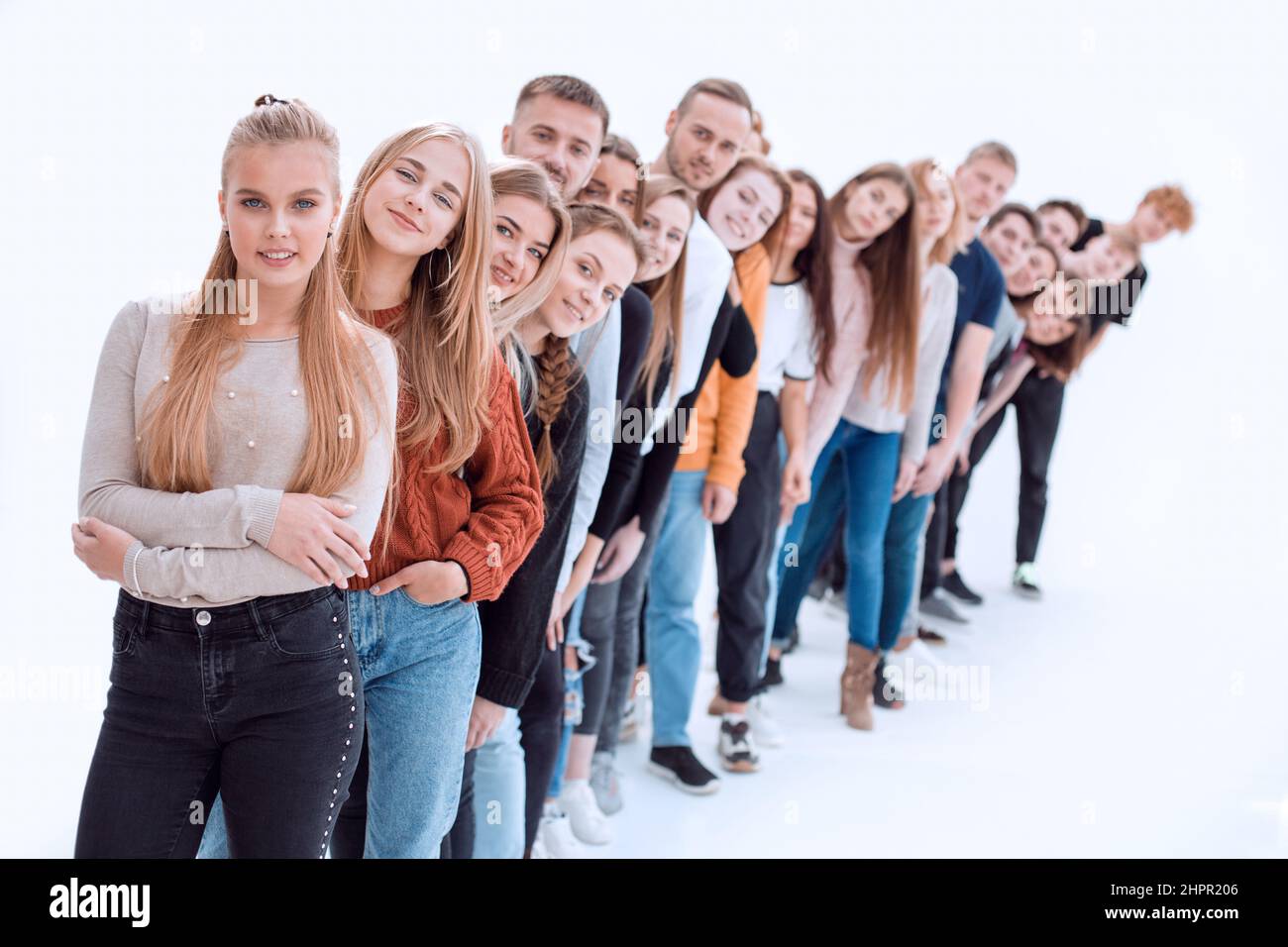 group of happy young people standing in line Stock Photo - Alamy