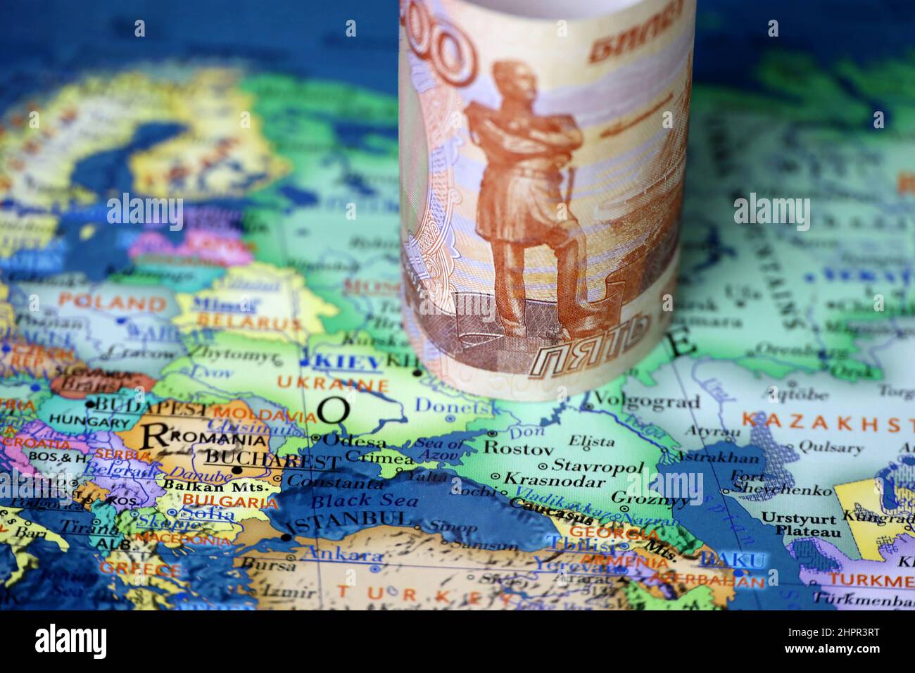 Russian rubles on map of Ukraine and Russia. Concept of russian support for Donbass Stock Photo