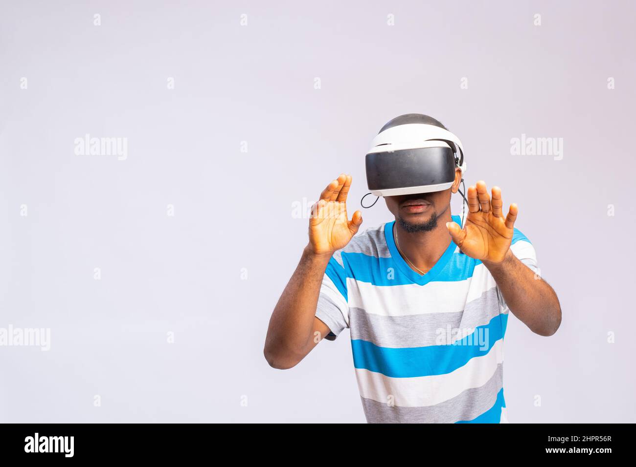 Handsome African man using VR glasses. Virtual reality experience Stock ...