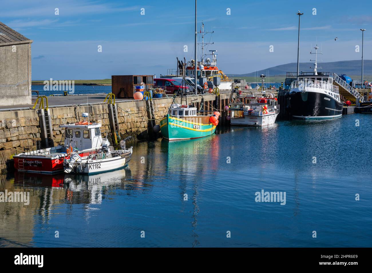 Boats tied up on quayside at Stromness harbour – Stromness, Mainland Orkney, Scotland, UK Stock Photo