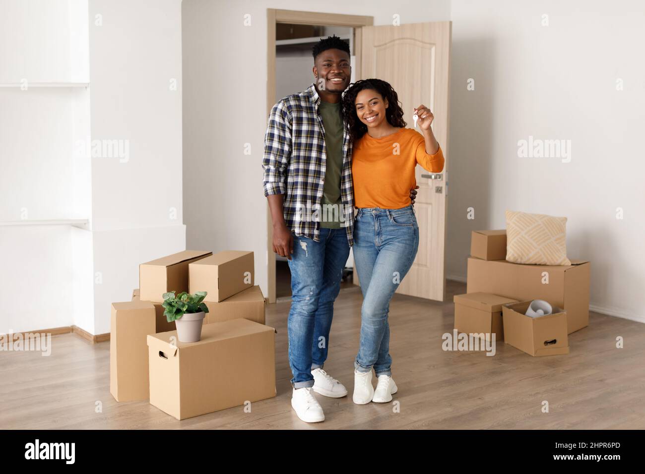 Happy African American Couple Holding New House Key Standing Indoors ...