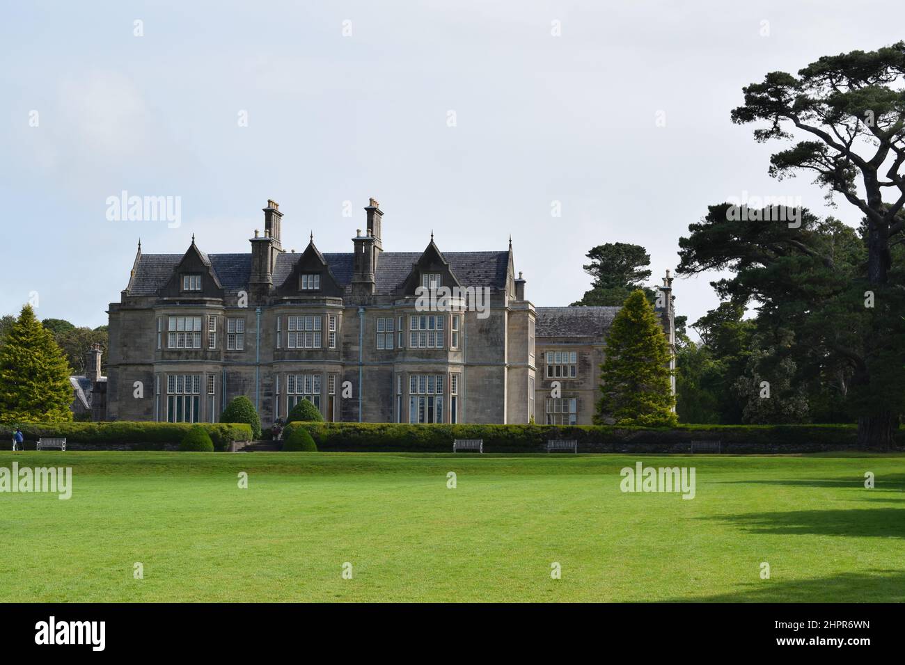 Muckross House view. House building and beautiful green meadow. CIll Airne. Killarney National Park. Ireland. Stock Photo