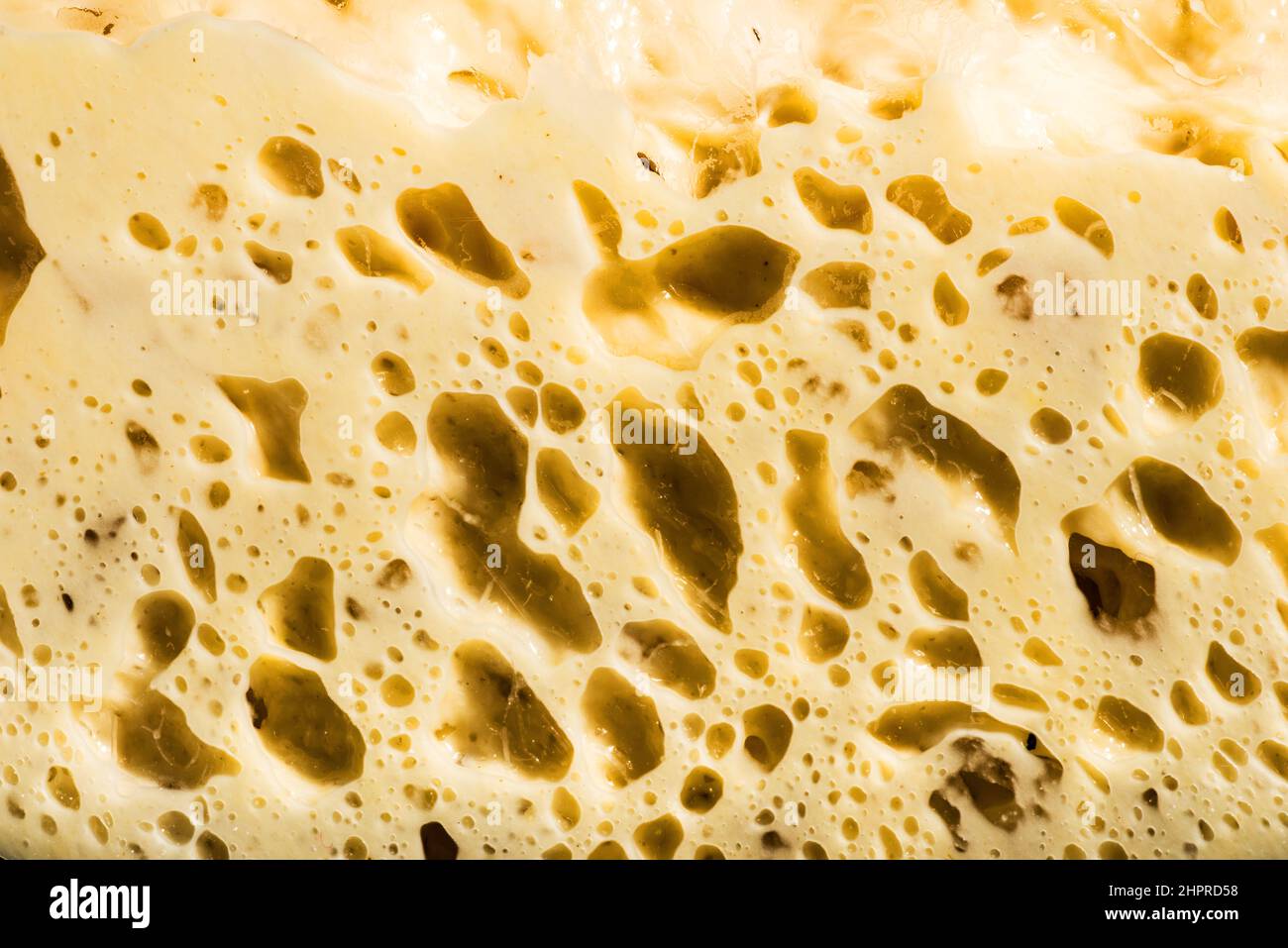 the natural yeast rises and creates bubbles in the dough Stock Photo