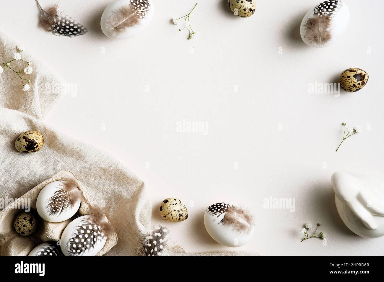 Easter flat lay composition. Easter eggs with feathers on white ...