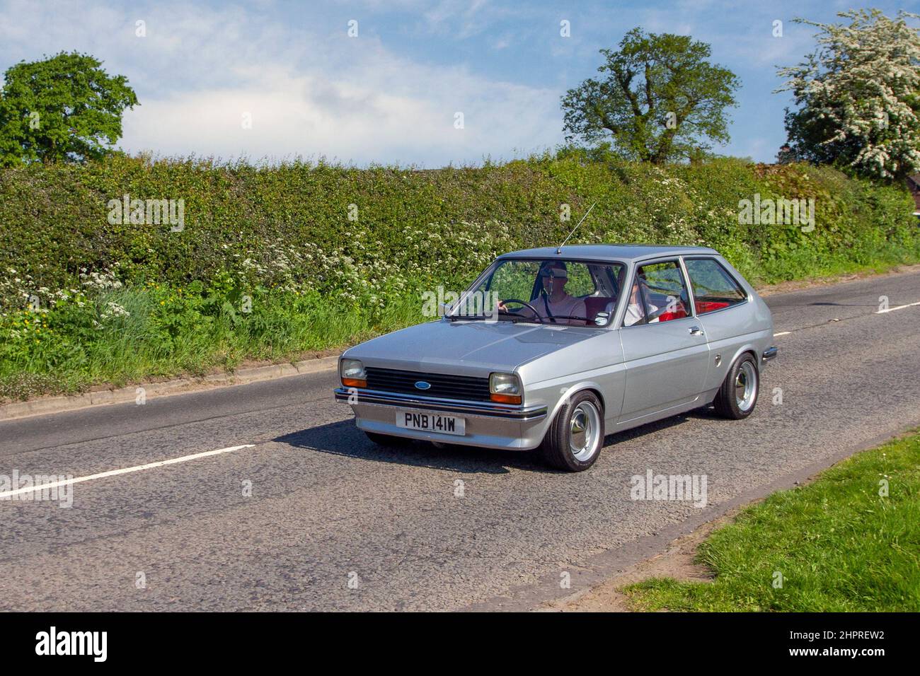 1981 80s eighties silver Ford Fiesta 2dr 1117cc petrol; en-route to Capesthorne Hall classic May car show, Cheshire, UK Stock Photo