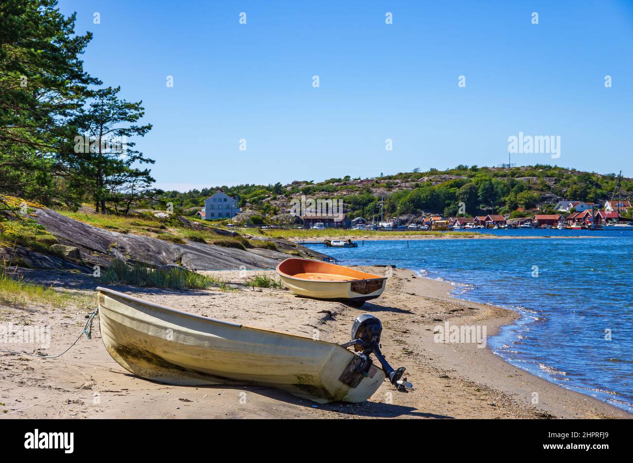 Two boats lie ashore on the North shore of Southkoster Island and beautiful view of the North Koster Island, Bohuslän, Sweden. Stock Photo