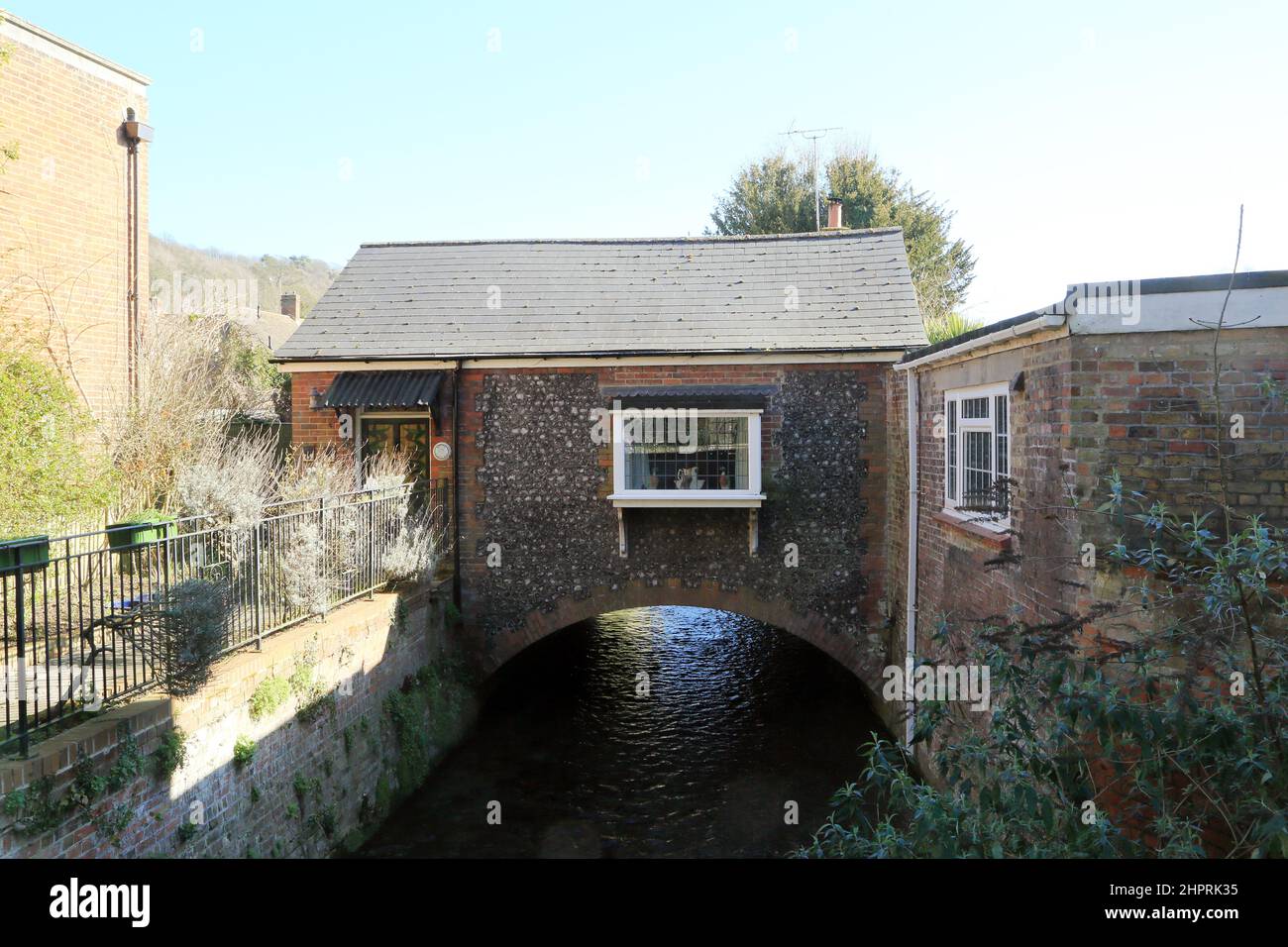 Small flint cottage built over the River Dour called River Cottage