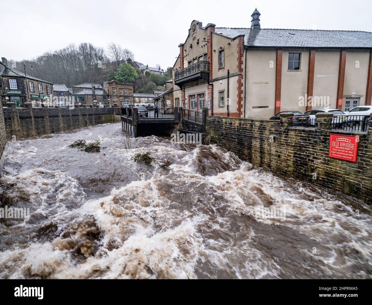 Holmfirth, West Yorkshire, England, 21st February, 2022, The storm swollen River Holme, passes through Holmfirth after the torrential rain of Storm Fr Stock Photo