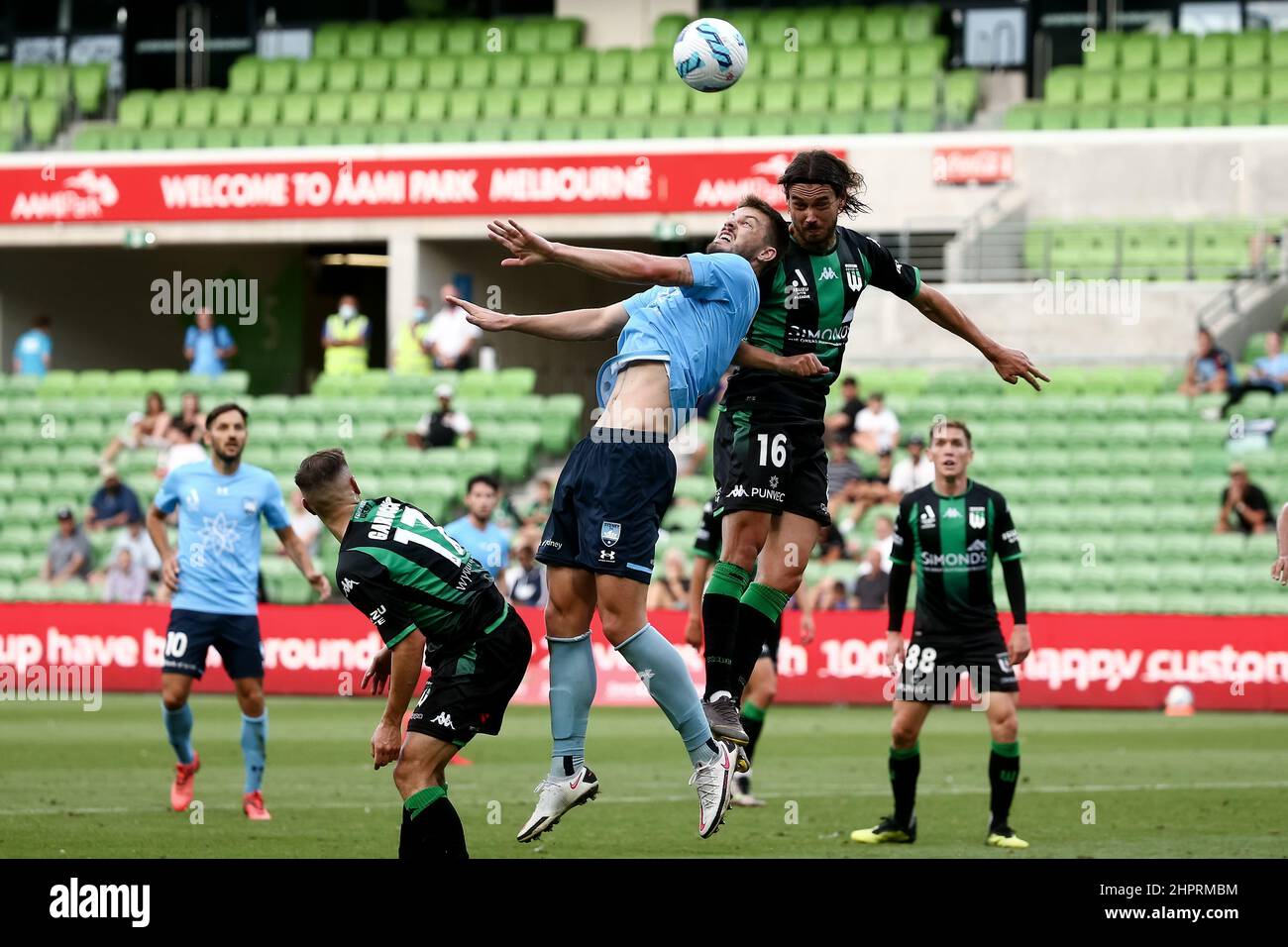 Melbourne, Australia, 23 February, 2022. James Donachie of Sydney FC heads the ball ahead of Rene Krhin of Western United during the A-League soccer match between Western United and Sydney FC at AAMI Park on February 23, 2022 in Melbourne, Australia. Credit: Dave Hewison/Speed Media/Alamy Live News Stock Photo
