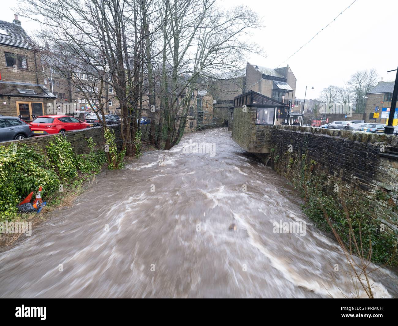 Holmfirth, West Yorkshire, England, 21st February, 2022, The storm swollen River Holme, passes through Holmfirth after the torrential rain of Storm Fr Stock Photo