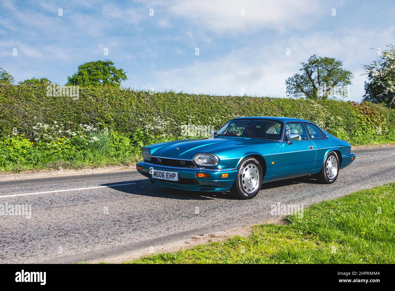 1995 90s nineties Jaguar XJS XJR SupChr 3980cc 4 speed automatic.  DOHC Inline 6-Cylinder Engine Multi-port Fuel injection 233bhb at 4,700rpm 4-Speed Automatic Transmission 4-Wheel Independent Suspension supercar en-route to Capesthorne Hall classic May car show, Cheshire, UK Stock Photo