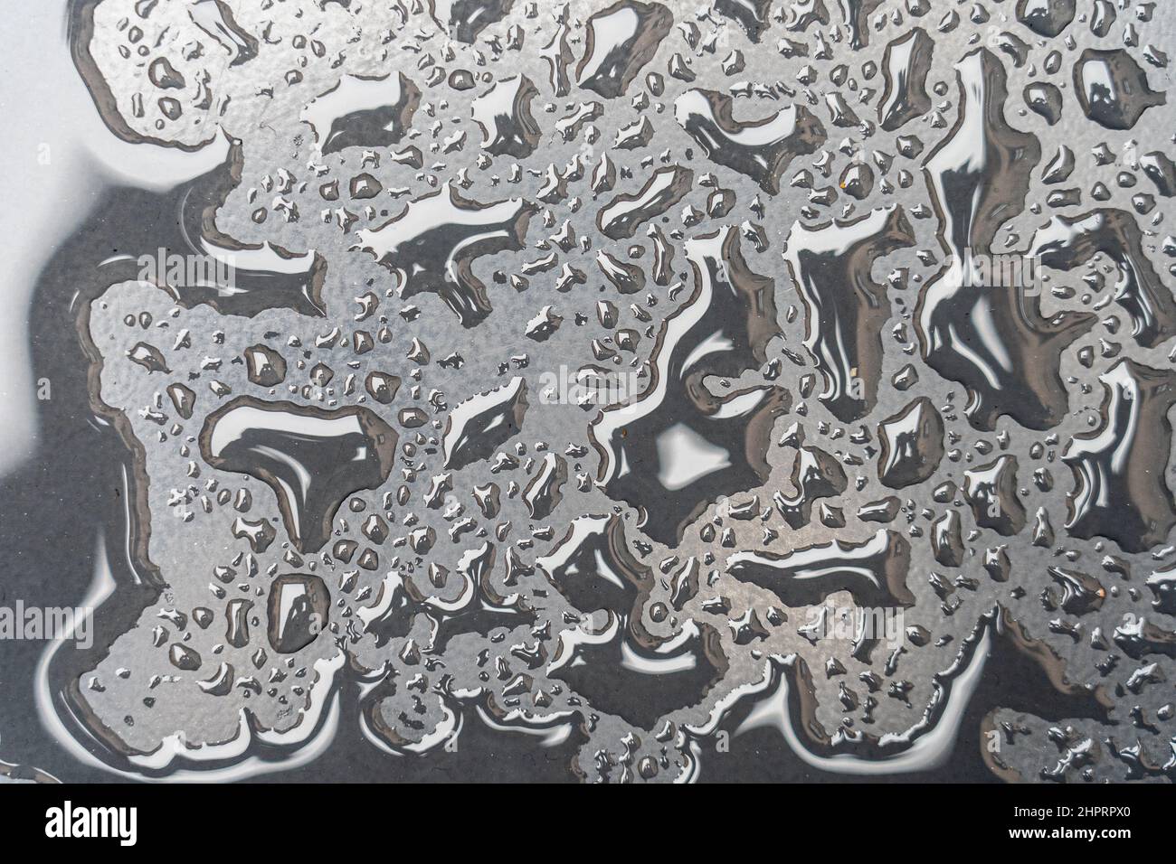 water drops on a metal surface showing freshness concept Stock Photo