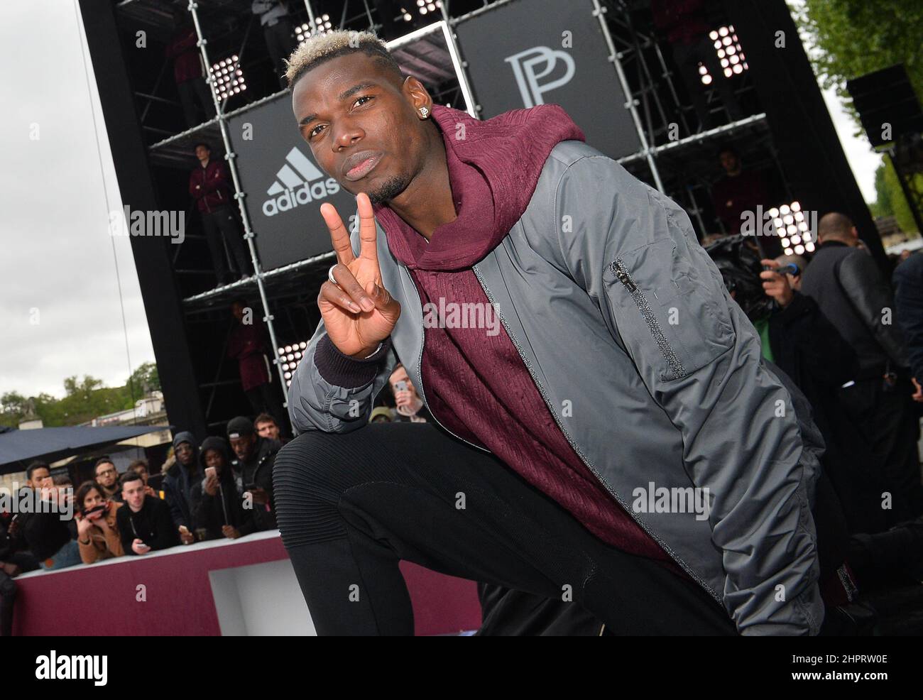 French International football player Paul Pogba attends the launch of the Adidas Football X Paul Pogba Capsule Collection in front of the Eiffel Tower Stock Photo