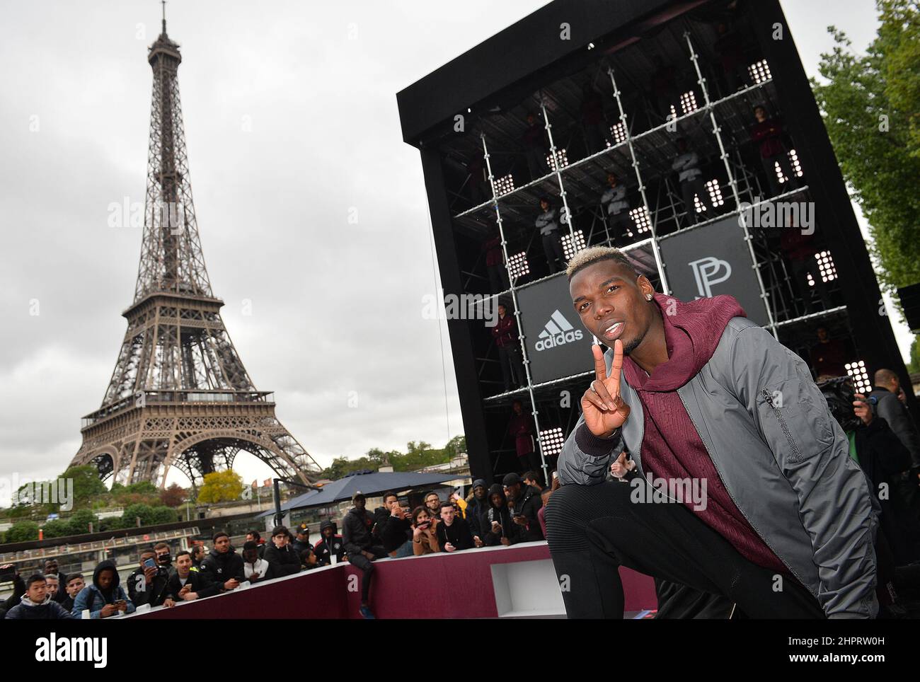 French International football player Paul Pogba attends the launch of the Adidas Football X Paul Pogba Capsule Collection in front of the Eiffel Tower Stock Photo