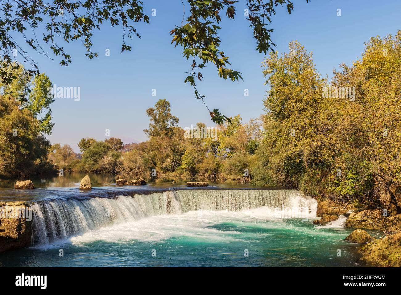Turquoise water of Manavgat River flowing over the Manavgat Waterfall. Stock Photo