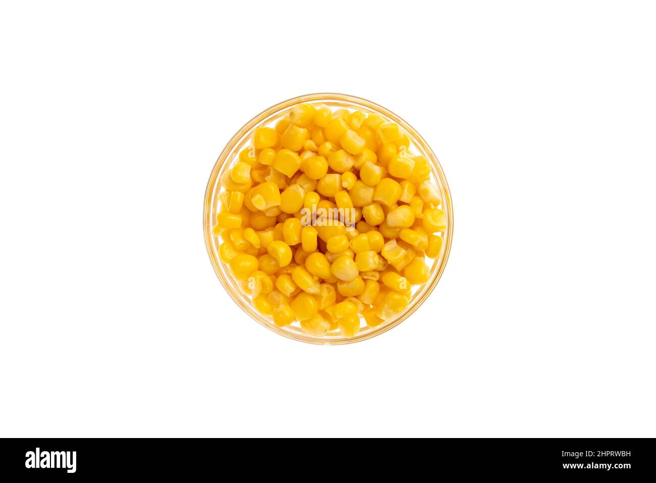 Canned corn seeds in a bowl isolated on white background, object from above, top view. Glass saucer Stock Photo