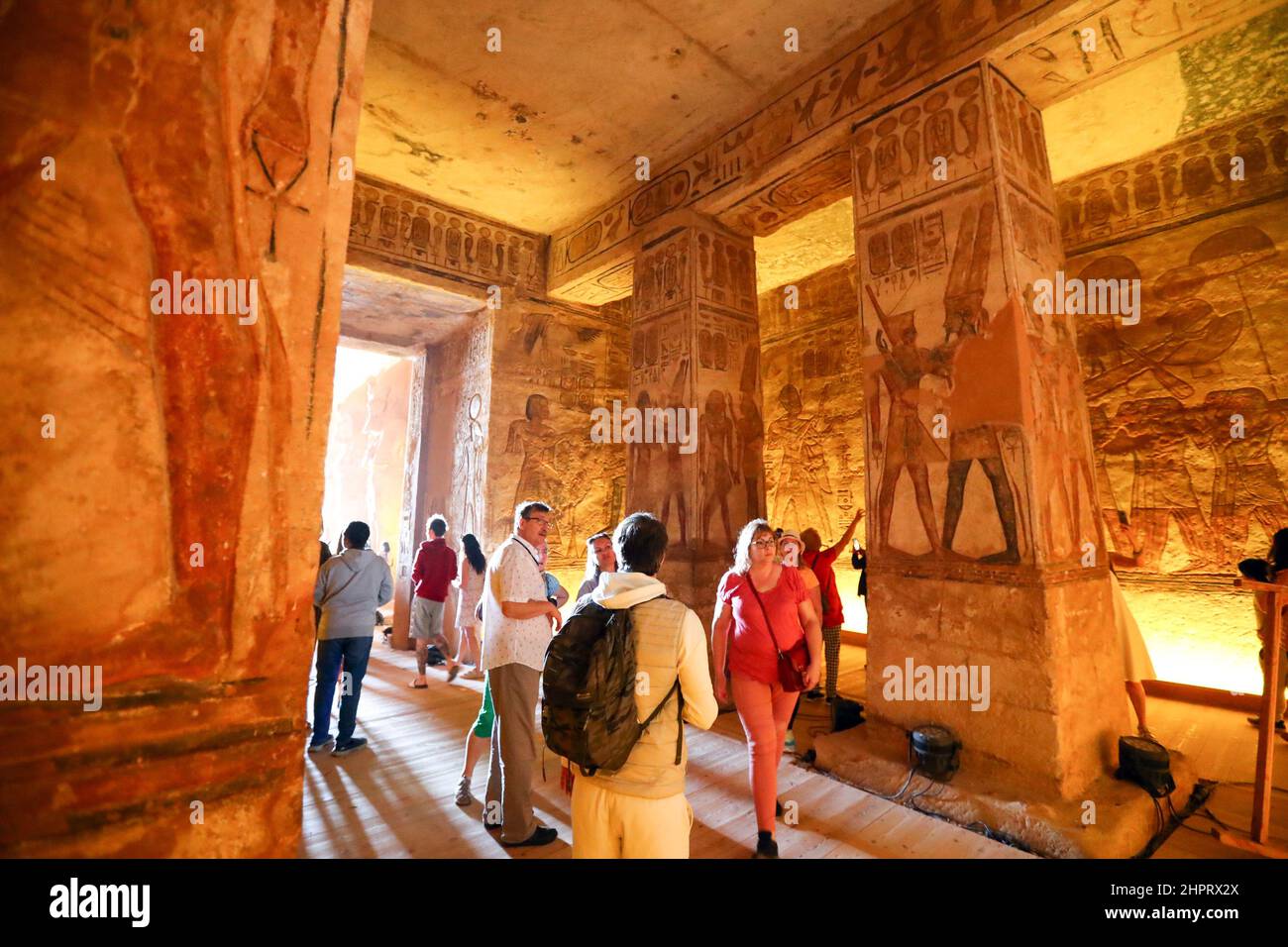 CAIRO, Feb. 23, 2022 (Xinhua) -- Tourists visit the Great Temple of Abu Simbel in Aswan, Egypt, Feb. 22, 2022. Abu Simbel temple complex consists of two massive rock-cut temples in southern Egyptian Aswan. On Feb. 22 and Oct. 22, the rays of the sun would reach and illuminate the sculptures on the back wall. (Xinhua/Sui Xiankai) Stock Photo